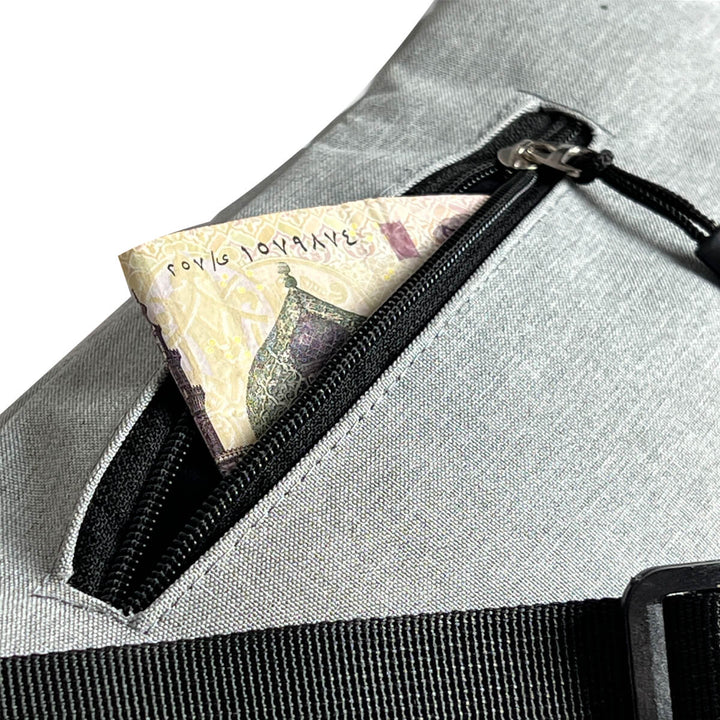 Multi-pocketed waist bag designed for carrying money, cards and other essentials.