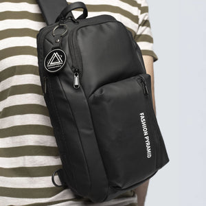 Black sling bag with 'Fashion Pyramid' branding worn by a person in a striped shirt.