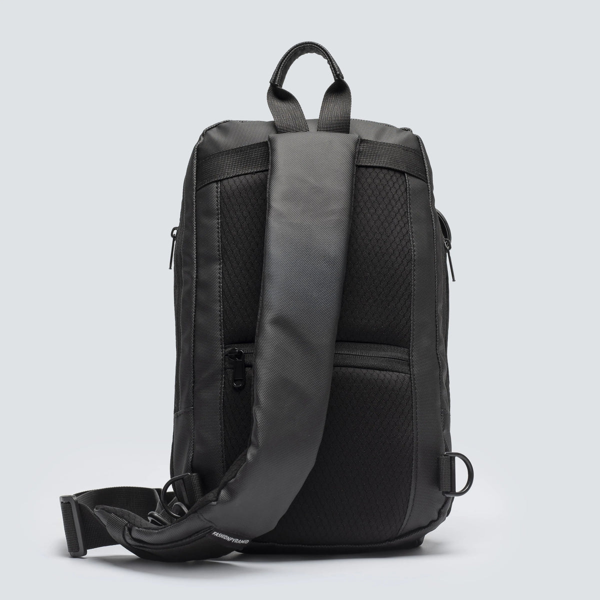Black backpack with a gray back panel on a light gray background