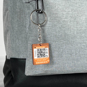 Gray Pyramid Backpack shown with the optional SafeCode QR tag (sold separately, EGP 50). Fashionpyramid