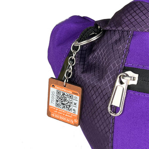 Purple Beehive waist bag shown with the optional SafeCode QR tag (sold separately, EGP 50)