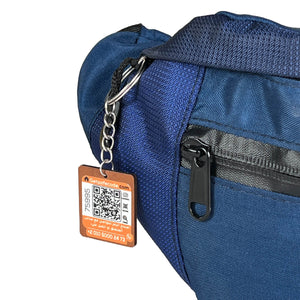 Navy Beehive waist bag shown with the optional SafeCode QR tag (sold separately, EGP 50). FashionPyramid