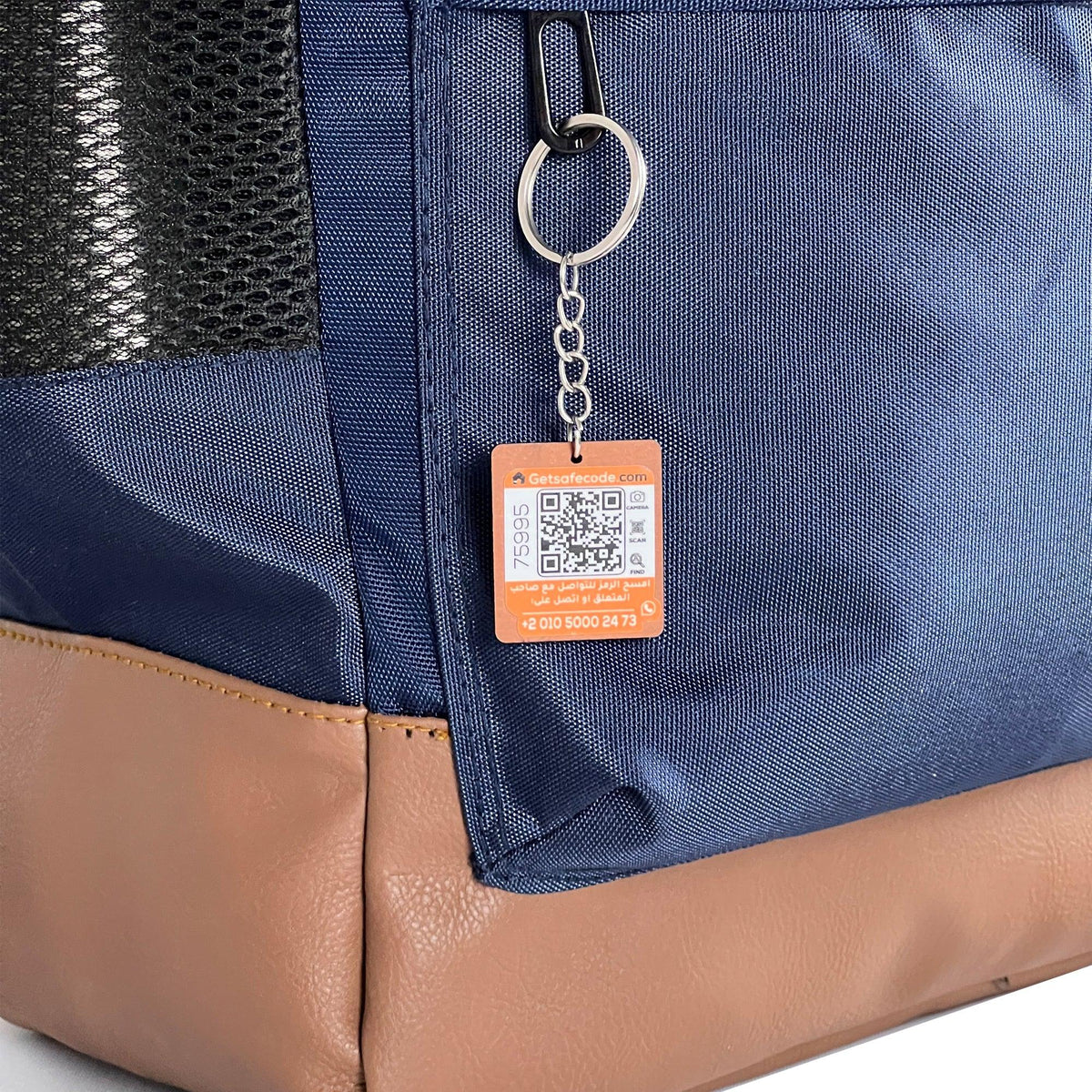 Navy Pyramid Backpack shown with the optional SafeCode QR tag (sold separately, EGP 50). Fashionpyramid