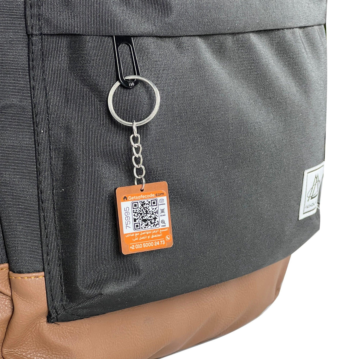 Pyramid Backpack shown with the optional SafeCode QR tag (sold separately, EGP 50). Fashionpyramid
