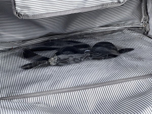 The wet clothes pocket  located on the side or at the bottom of the duffel bag