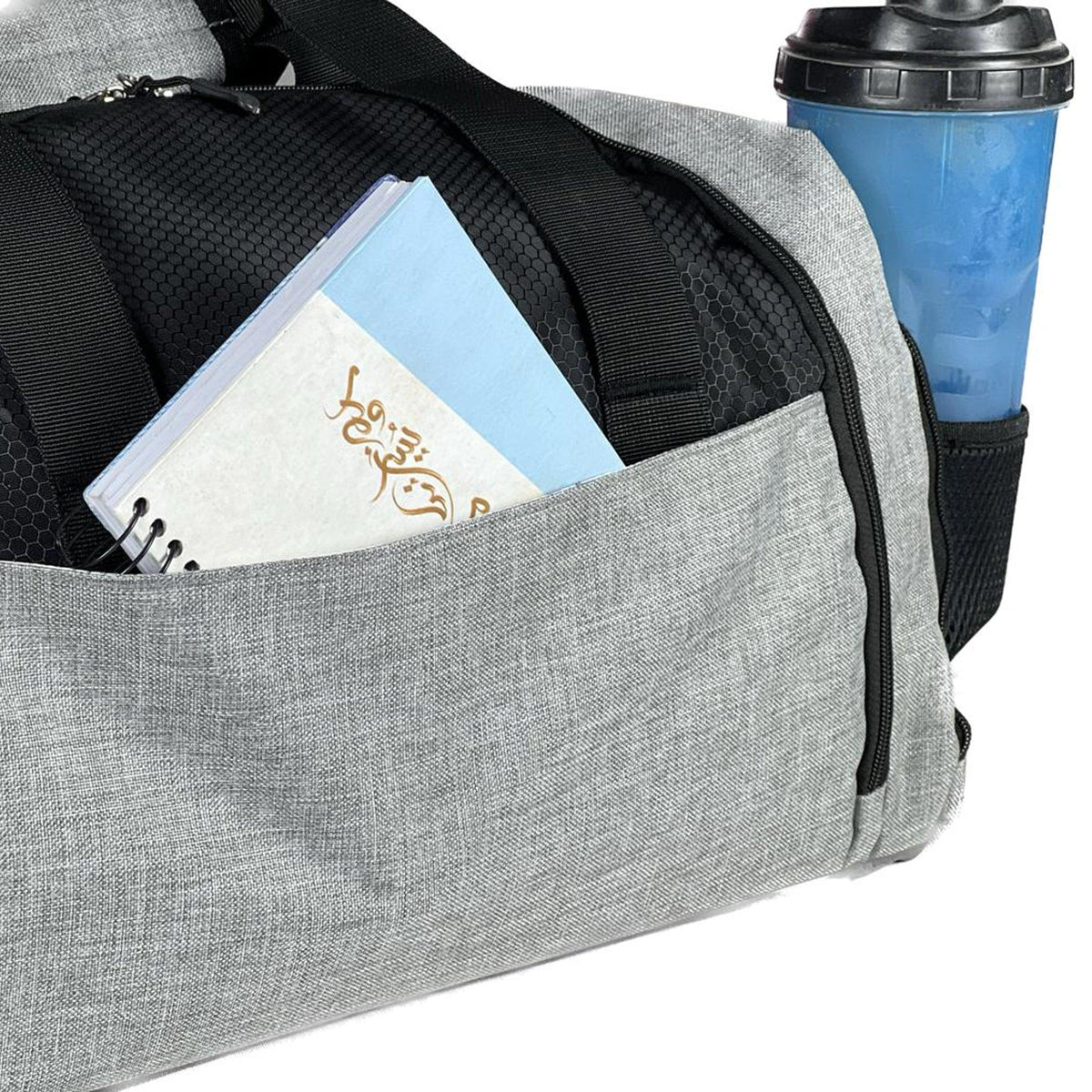 The bag is designed to be carried using two handles or a shoulder strap and is often used for sports or travel.